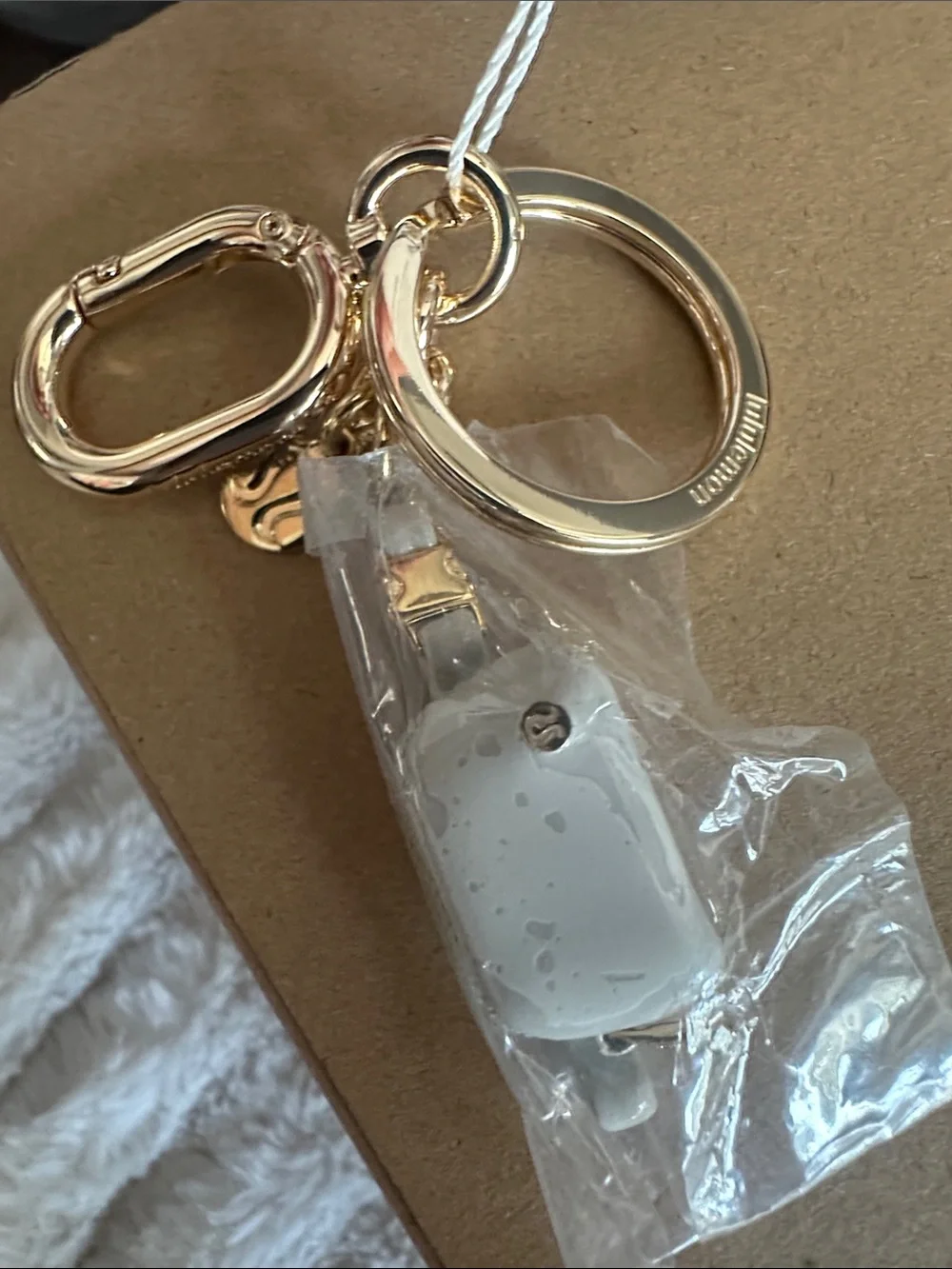 Everywhere belt bag charm keychain Gold Tone Key Ring Charm with Cream Accent